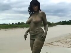 Busty lady in tights and mud