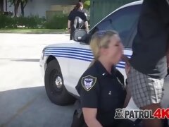 Hardcore BBC deep throat in public by two hot MILF cops with big tits!